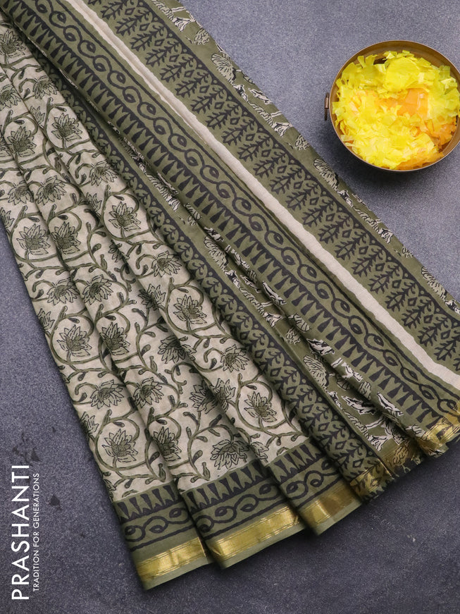 Muslin cotton saree cream and green with allover floral prints and small zari woven border