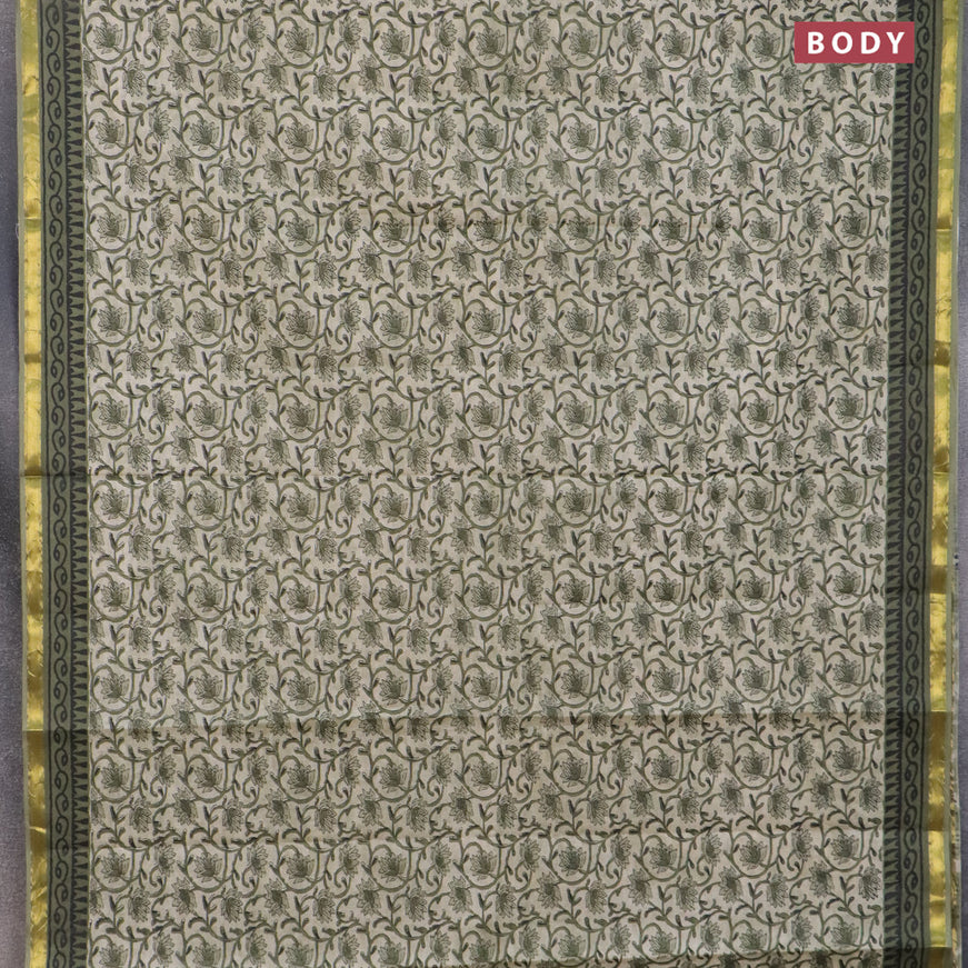 Muslin cotton saree cream and green with allover floral prints and small zari woven border