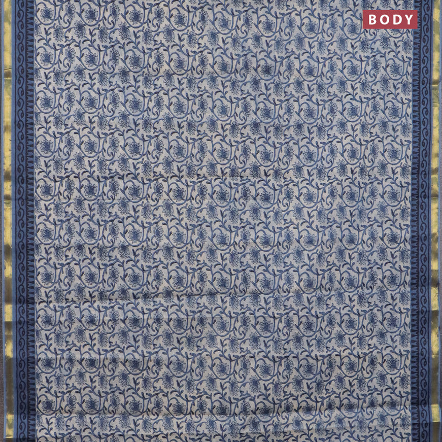 Muslin cotton saree cream and blue with allover floral prints and small zari woven border