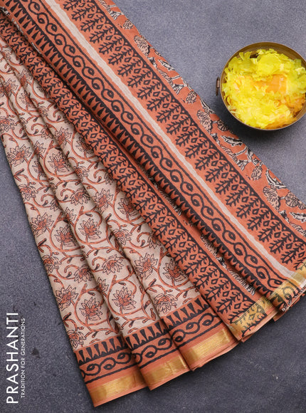 Muslin cotton saree sandal and orange with allover floral prints and small zari woven border