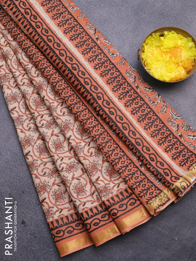 Muslin cotton saree sandal and orange with allover floral prints and small zari woven border