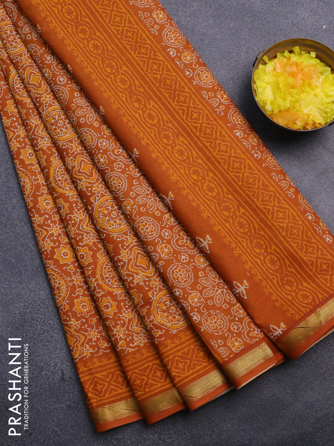 Muslin cotton saree dark mustard with allover ajrakh prints and small zari woven border