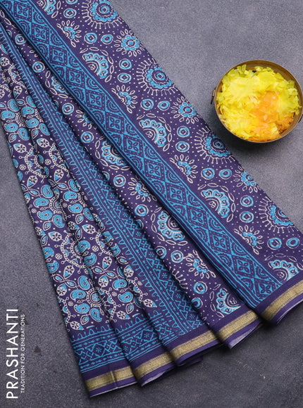 Muslin cotton saree blue with allover ajrakh prints and small zari woven border