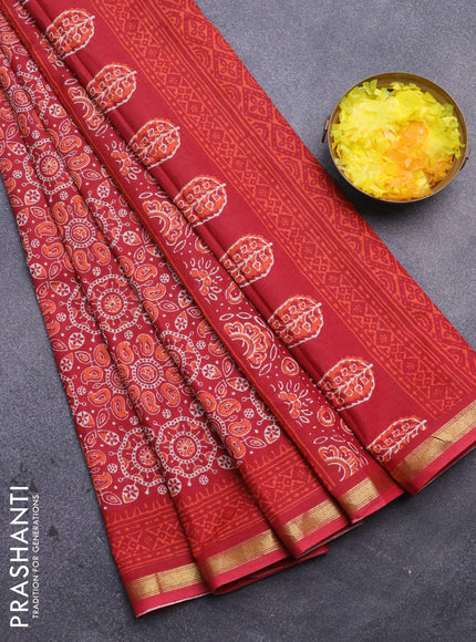 Muslin cotton saree red with allover ajrakh prints and small zari woven border