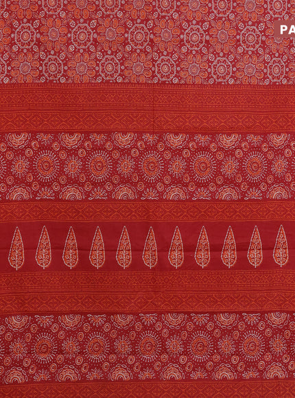 Muslin cotton saree red with allover ajrakh prints and small zari woven border