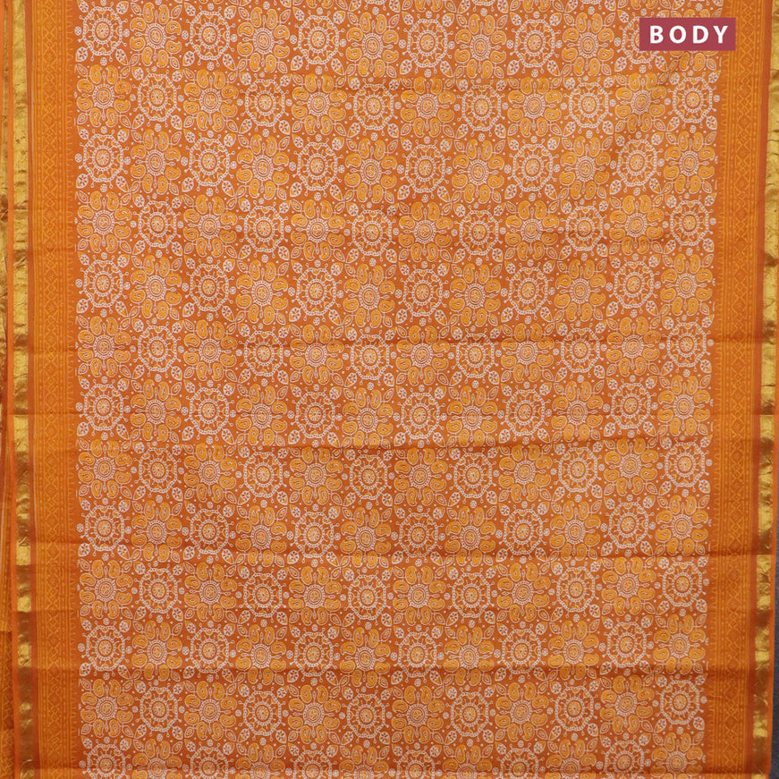 Muslin cotton saree orange with allover ajrakh prints and small zari woven border