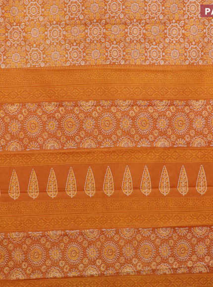 Muslin cotton saree orange with allover ajrakh prints and small zari woven border