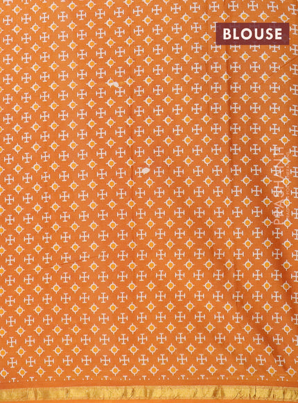 Muslin cotton saree orange with allover ajrakh prints and small zari woven border