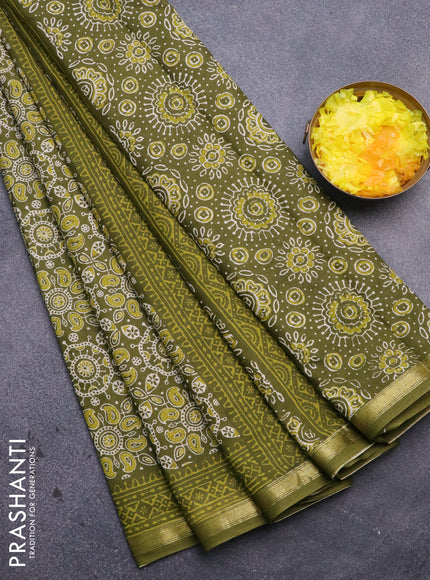 Muslin cotton saree sap green with allover ajrakh prints and small zari woven border