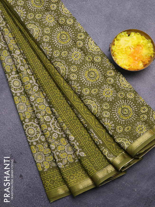 Muslin cotton saree sap green with allover ajrakh prints and small zari woven border