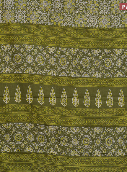 Muslin cotton saree sap green with allover ajrakh prints and small zari woven border