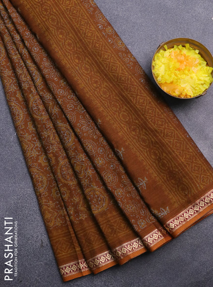 Muslin cotton saree dark mustard with allover ajrakh prints and thread woven border