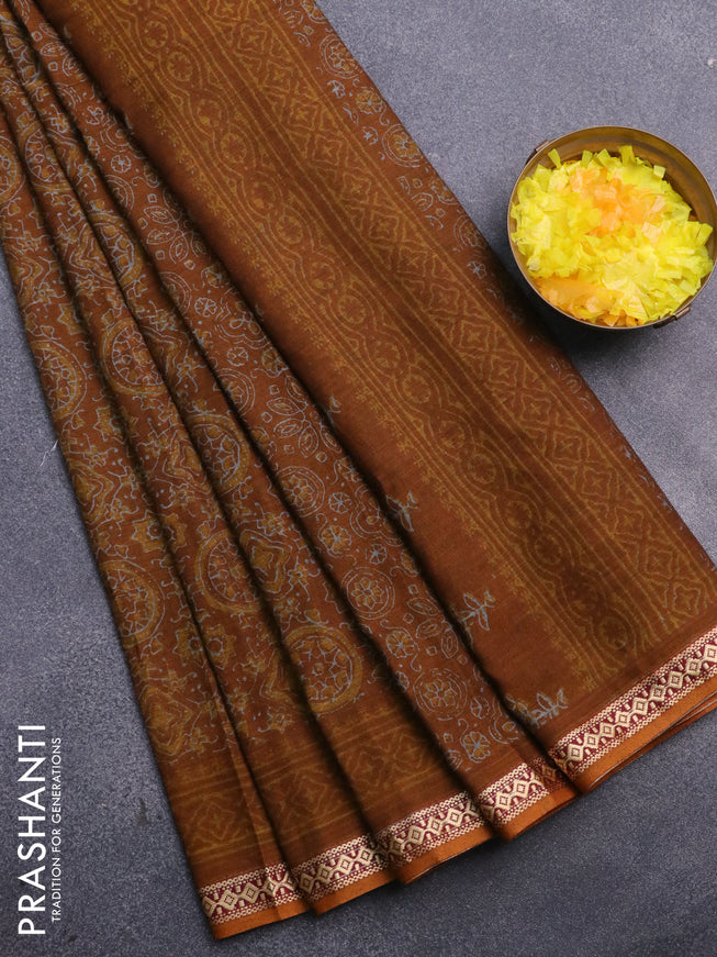 Muslin cotton saree dark mustard with allover ajrakh prints and thread woven border