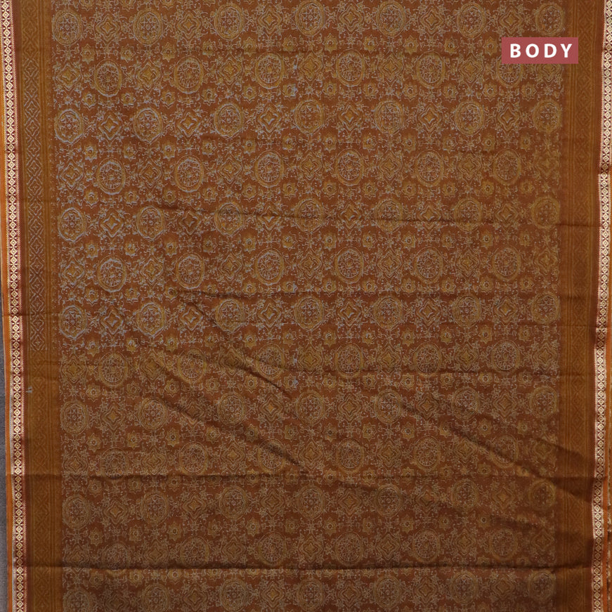 Muslin cotton saree dark mustard with allover ajrakh prints and thread woven border