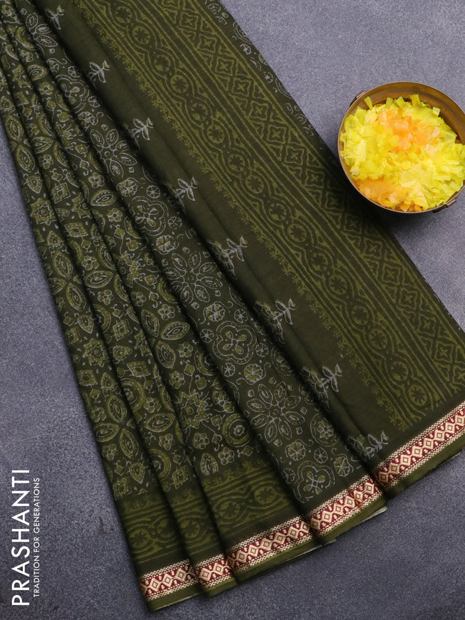 Muslin cotton saree sap green with allover ajrakh prints and thread woven border