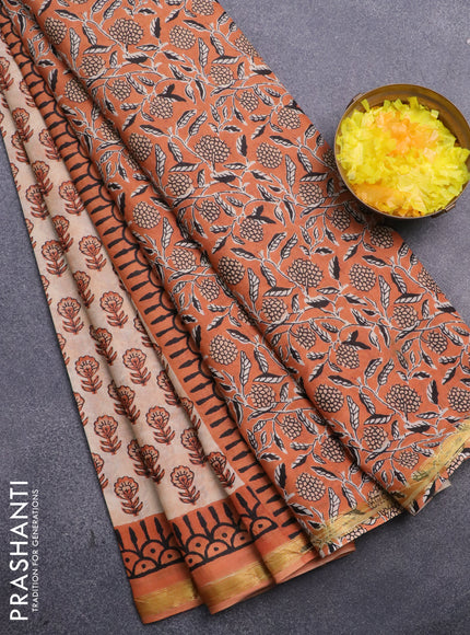 Muslin cotton saree sandal and orange with allover floral butta prints and small zari woven border