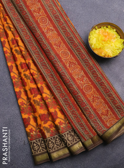 Muslin cotton saree orange and brown with allover kalamkari prints and small zari woven border