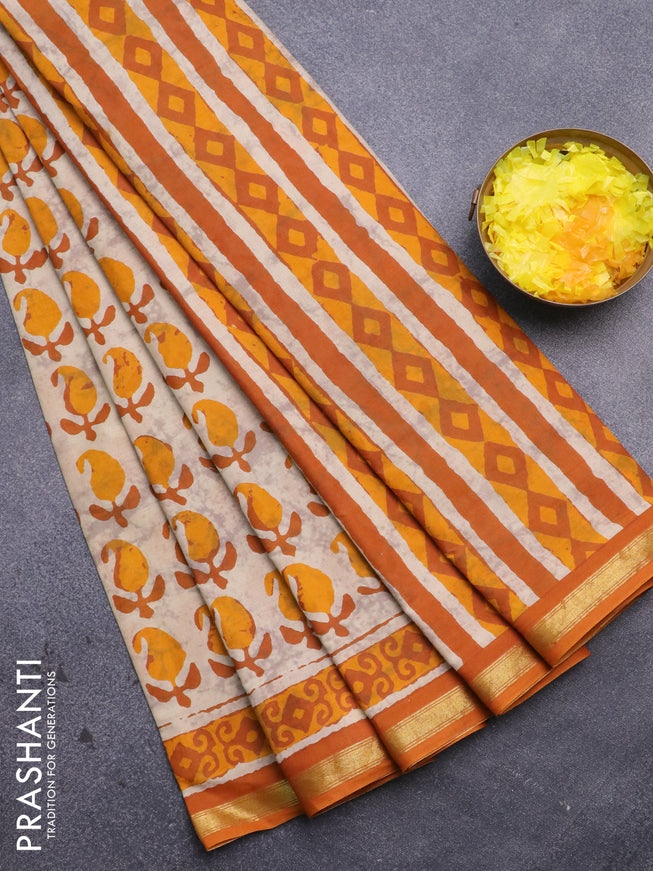 Muslin cotton saree cream and mango yellow with allover paisley butta prints and small zari woven border