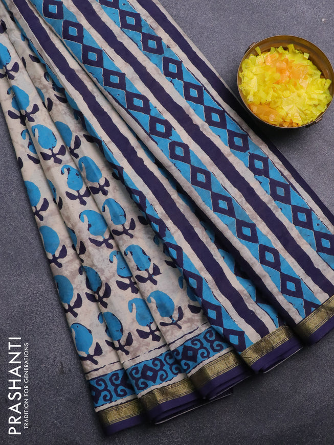 Muslin cotton saree cream and blue with allover paisley butta prints and small zari woven border