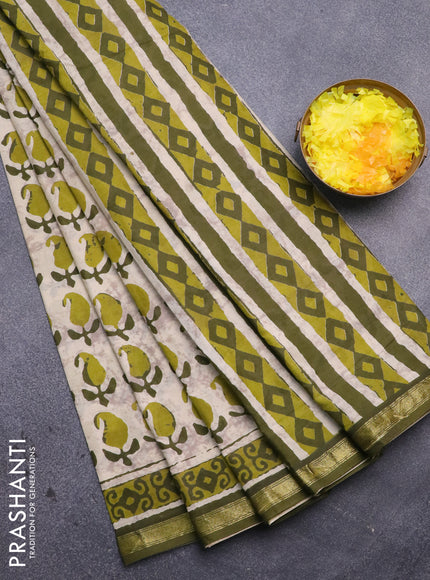 Muslin cotton saree cream and sap green with allover paisley butta prints and small zari woven border