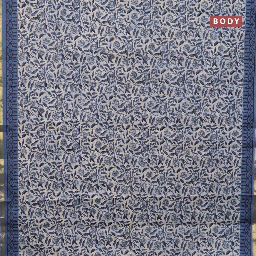 Muslin cotton saree cream and blue with allover floral prints and small zari woven border