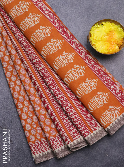 Muslin cotton saree mustard yellow and beige with allover floral prints and printed border