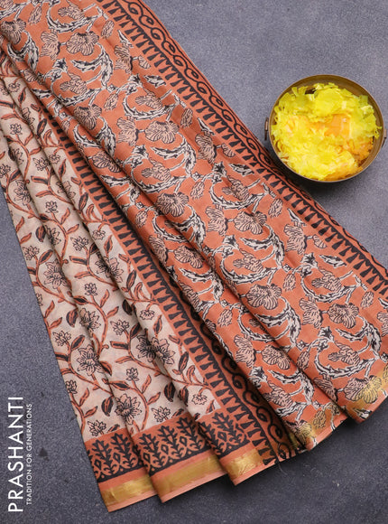 Muslin cotton saree sandal and orange with allover floral prints and small zari woven border