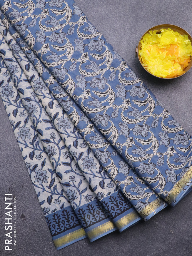 Muslin cotton saree cream and blue with allover floral prints and small zari woven border