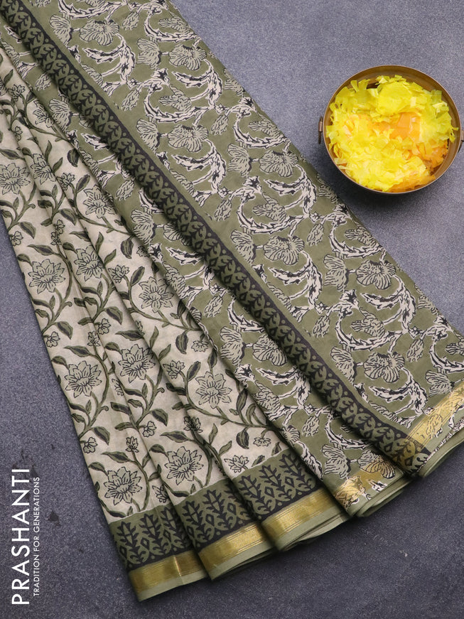 Muslin cotton saree cream and green with allover floral prints and small zari woven border