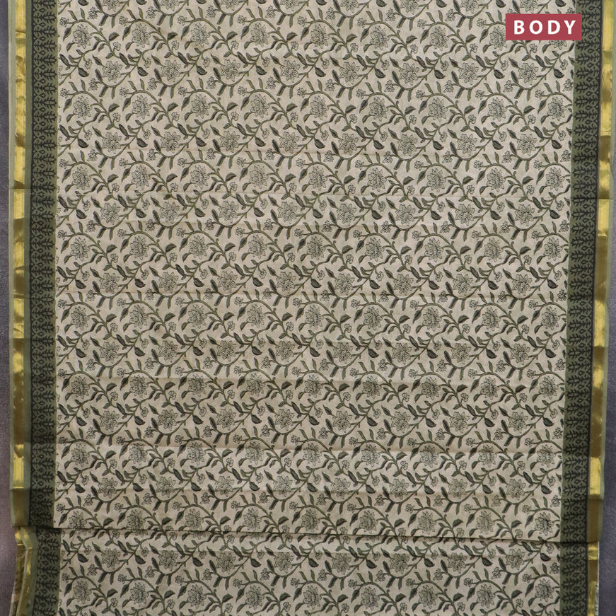 Muslin cotton saree cream and green with allover floral prints and small zari woven border