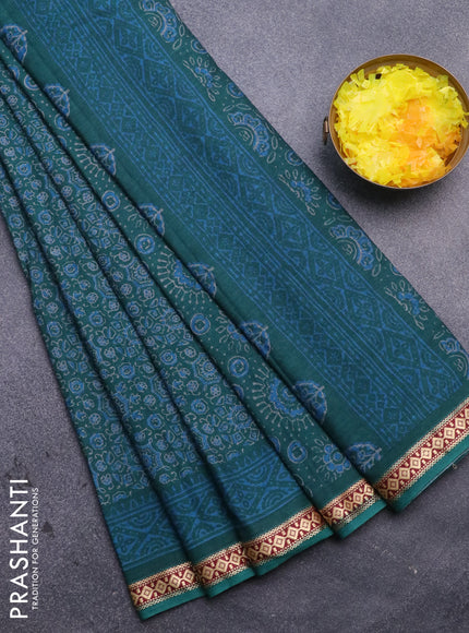 Muslin cotton saree peacock blue with allover ajrakh prints and thread woven border