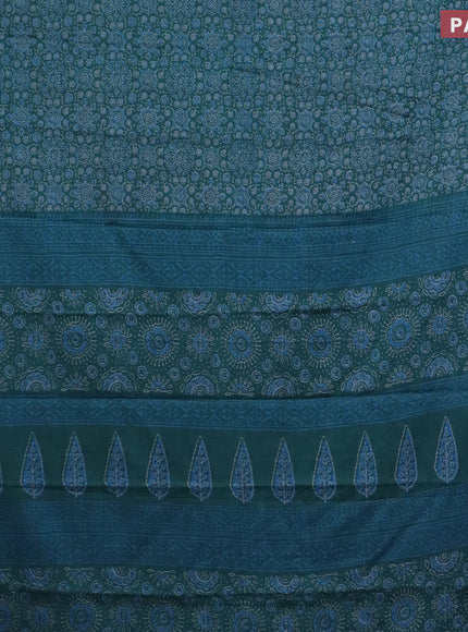 Muslin cotton saree peacock blue with allover ajrakh prints and thread woven border