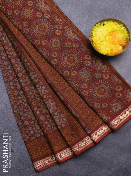 Muslin cotton saree rust shade with allover ajrakh prints and thread woven border