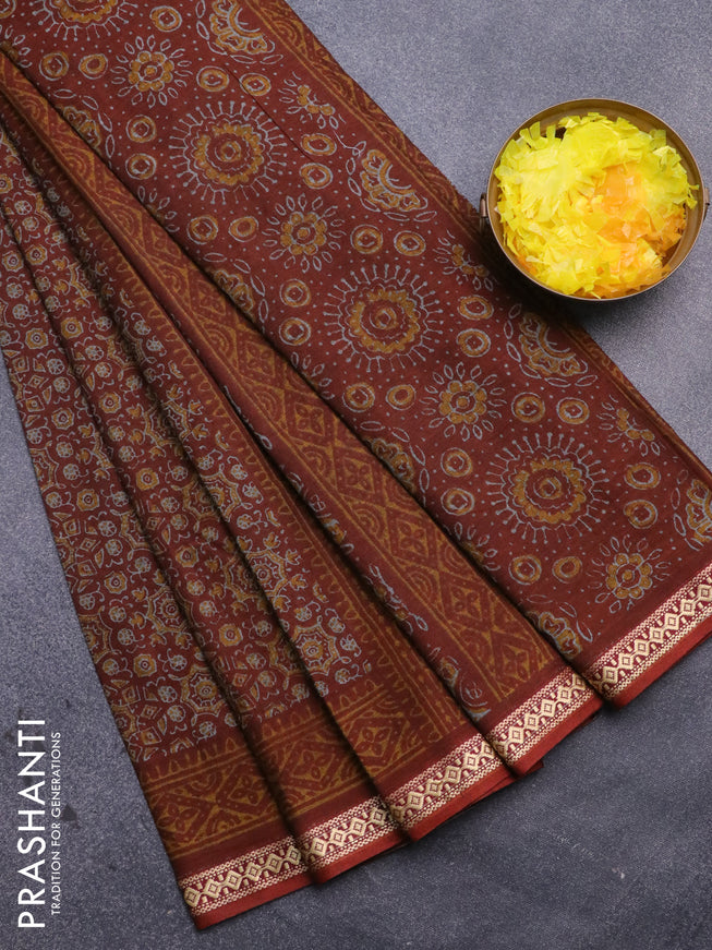 Muslin cotton saree rust shade with allover ajrakh prints and thread woven border