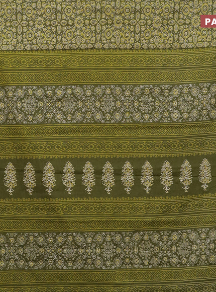 Muslin cotton saree sap green with allover ajrakh prints and small zari woven border