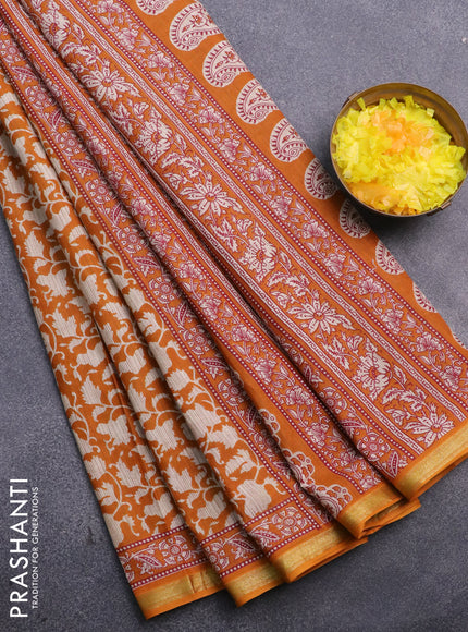 Muslin cotton saree mustard shade and beige with allover prints and small zari woven border