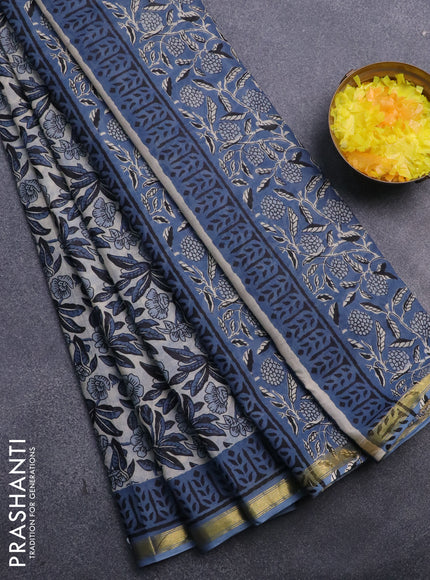 Muslin cotton saree cream and blue with allover floral prints and small zari woven border