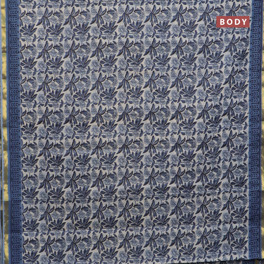 Muslin cotton saree cream and blue with allover floral prints and small zari woven border