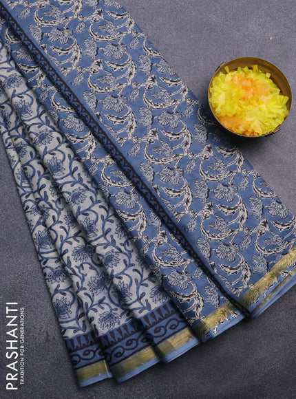 Muslin cotton saree cream and blue with allover floral prints and small zari woven border