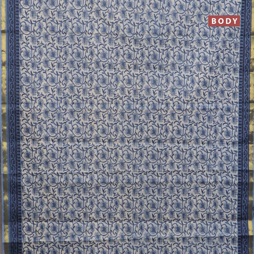 Muslin cotton saree cream and blue with allover floral prints and small zari woven border