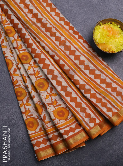 Muslin cotton saree cream and mustard yellow with allover prints and small zari woven border