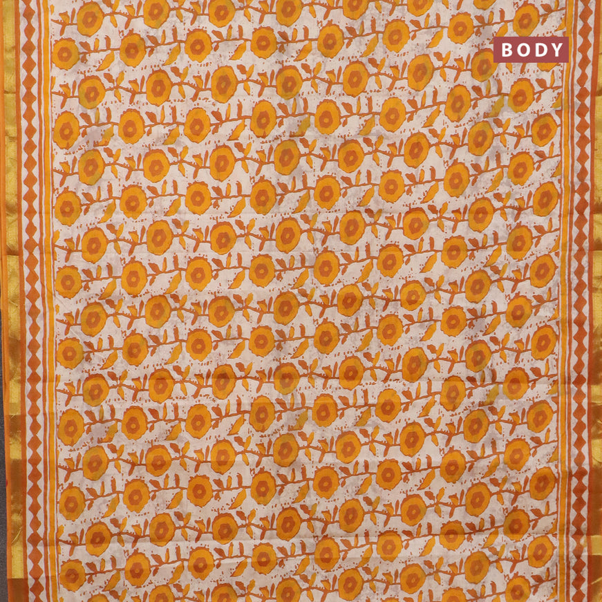 Muslin cotton saree cream and mustard yellow with allover prints and small zari woven border