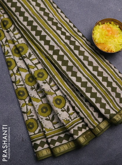 Muslin cotton saree cream and green with allover prints and small zari woven border