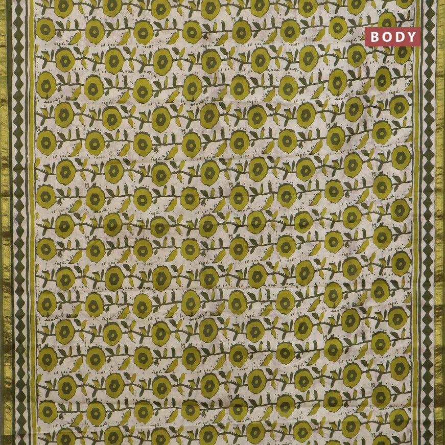 Muslin cotton saree cream and green with allover prints and small zari woven border