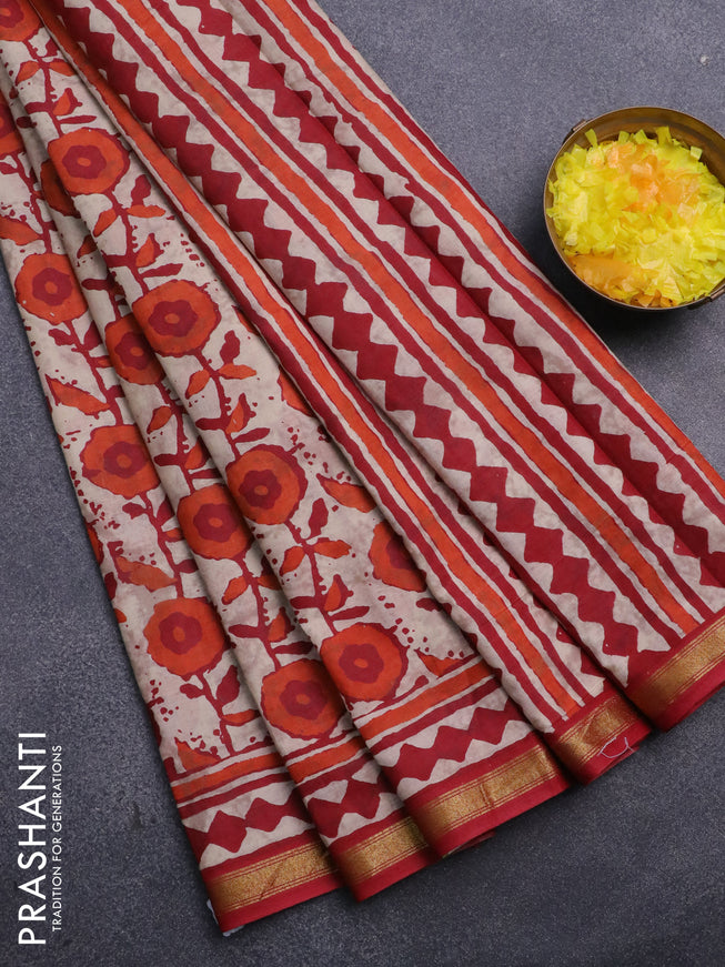 Muslin cotton saree cream and kumkum red with allover prints and small zari woven border