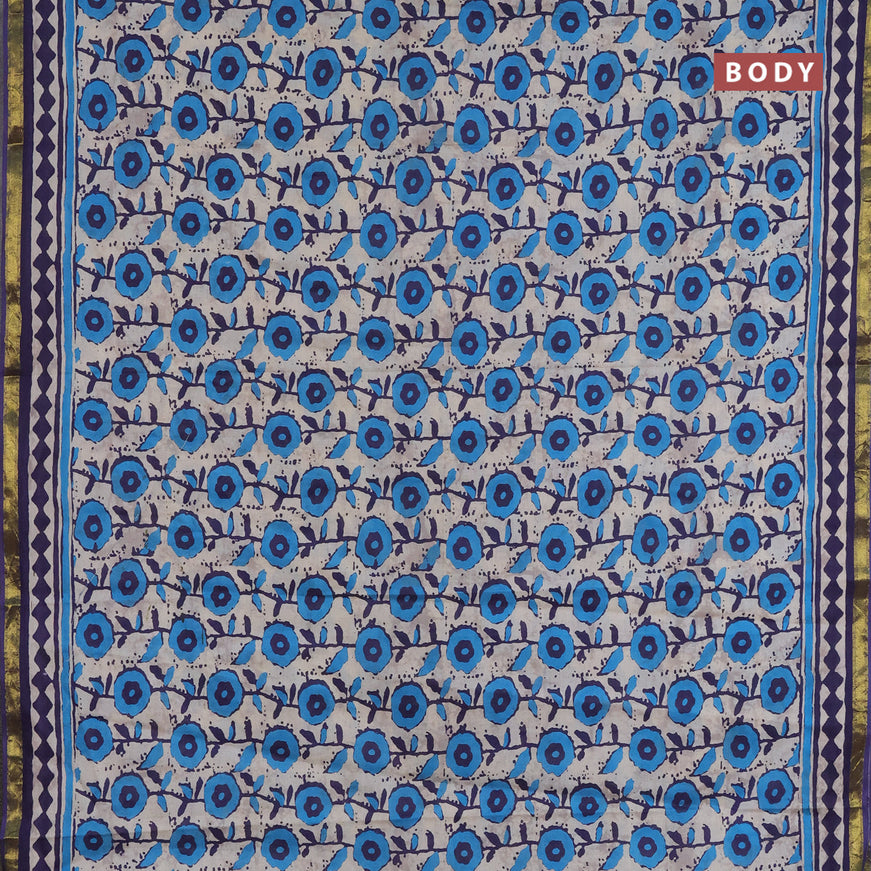 Muslin cotton saree cream and blue with allover prints and small zari woven border