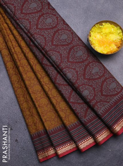 Muslin cotton saree dark mustard and maroon with allover prints and thread woven border