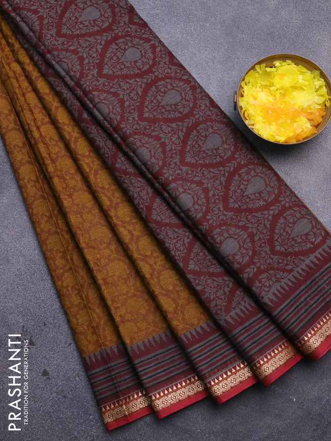 Muslin cotton saree dark mustard and maroon with allover prints and thread woven border