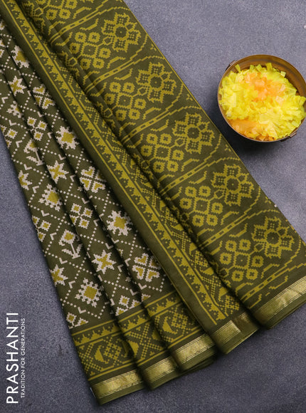 Muslin cotton saree sap green with allover ikat prints and small zari woven border