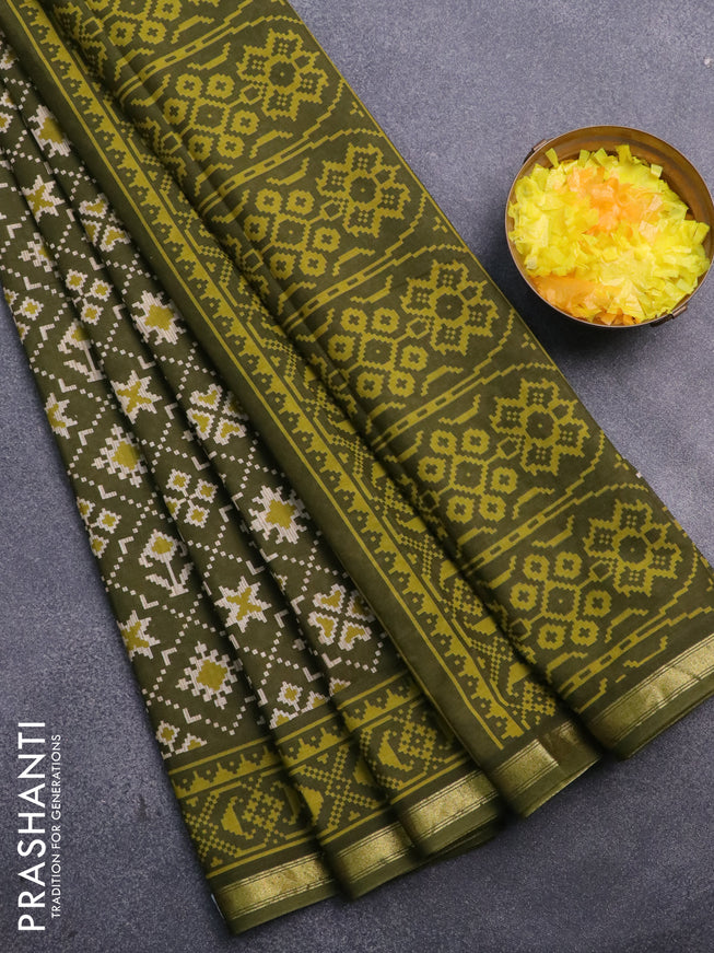 Muslin cotton saree sap green with allover ikat prints and small zari woven border